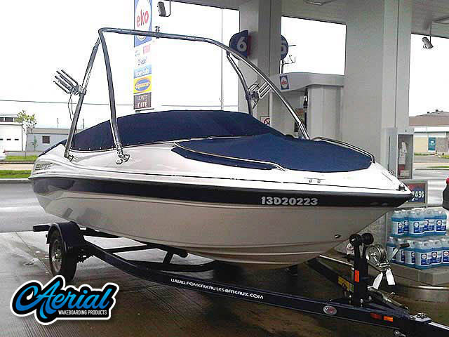 Customer photo of their boat with installed Aerial universal wakeboard tower, speakers, racks, bimini and wakeboard accessories