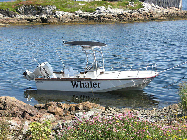1984 BOSTON WHALER OUTRAGE 20 center console boat with universal ttop by Stryker T-Tops installed